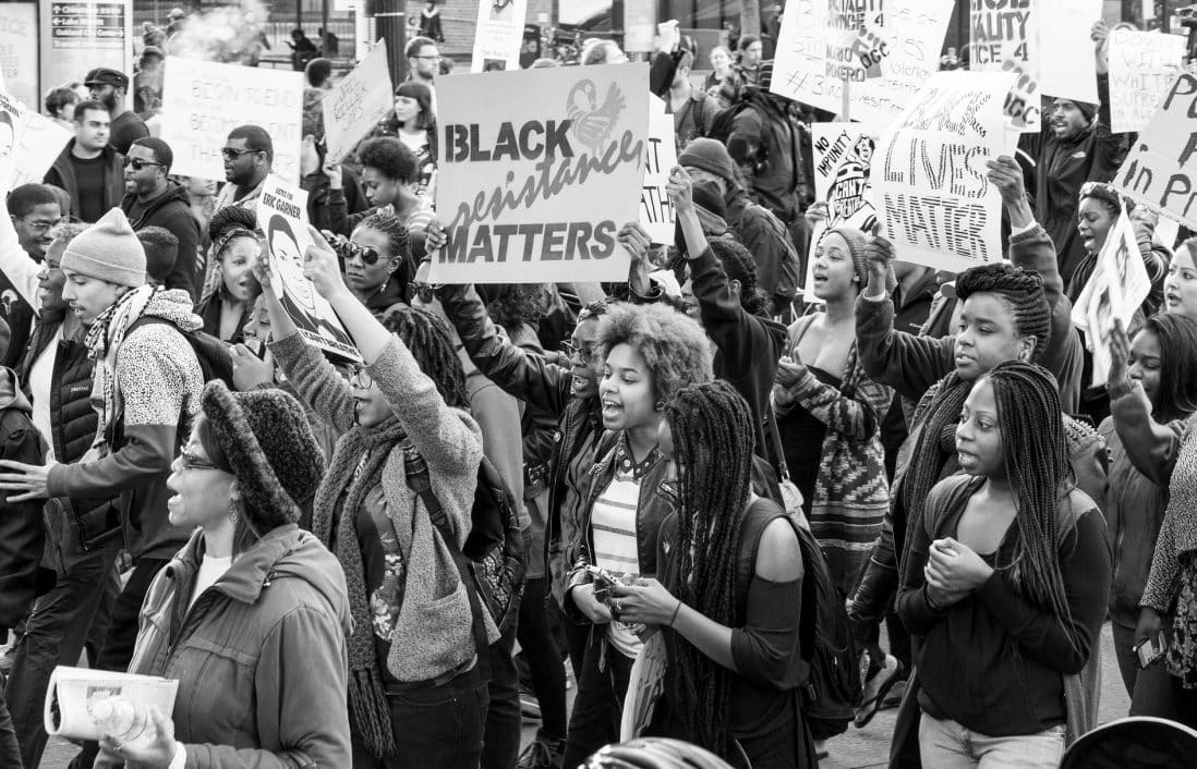 Alt Text: Black Lives Matter protestors standing in a crowd