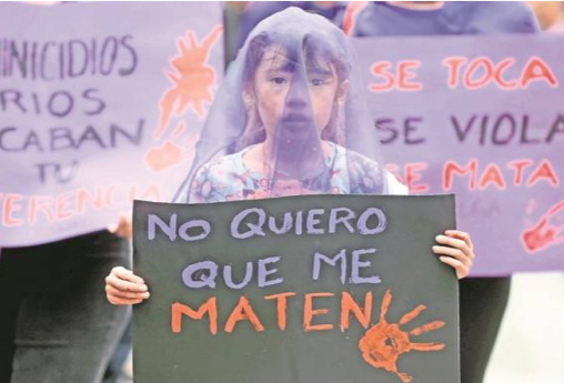 Alt Text: A young girl that is maybe 11-12 years-old is holding up a sign that reads: "I don't want them to kill me". She is wearing a purple sheer fabric over her face.